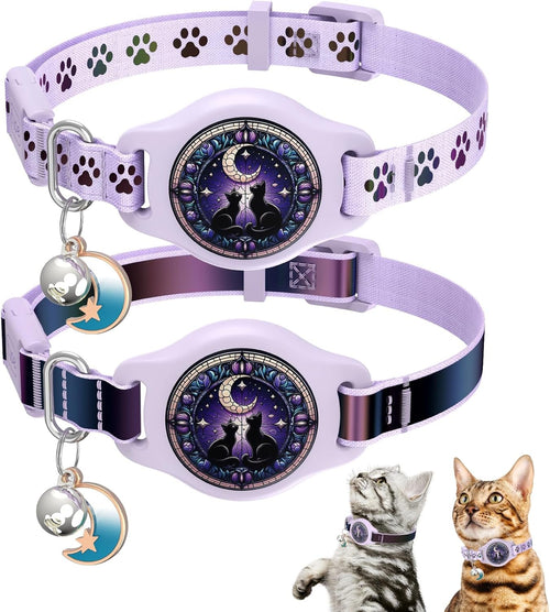 Two lavender pet collars with paw print patterns and a central moon-and-cat design, shown on a white background with small cat illustrations in the lower right. The collars have metal ID tags and a buckle closure.