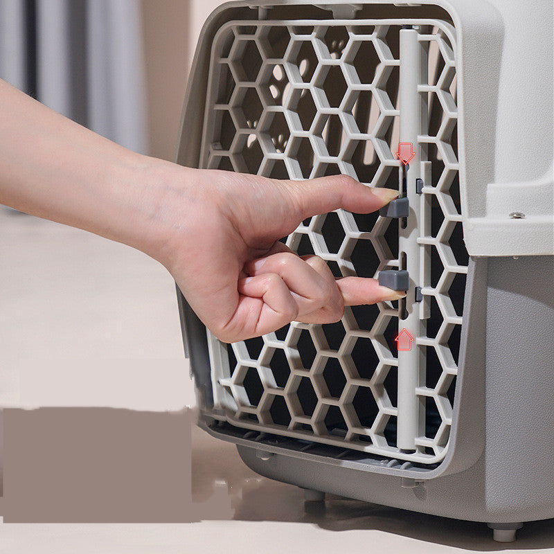 Hand opening a pet carrier with a hexagonal pattern